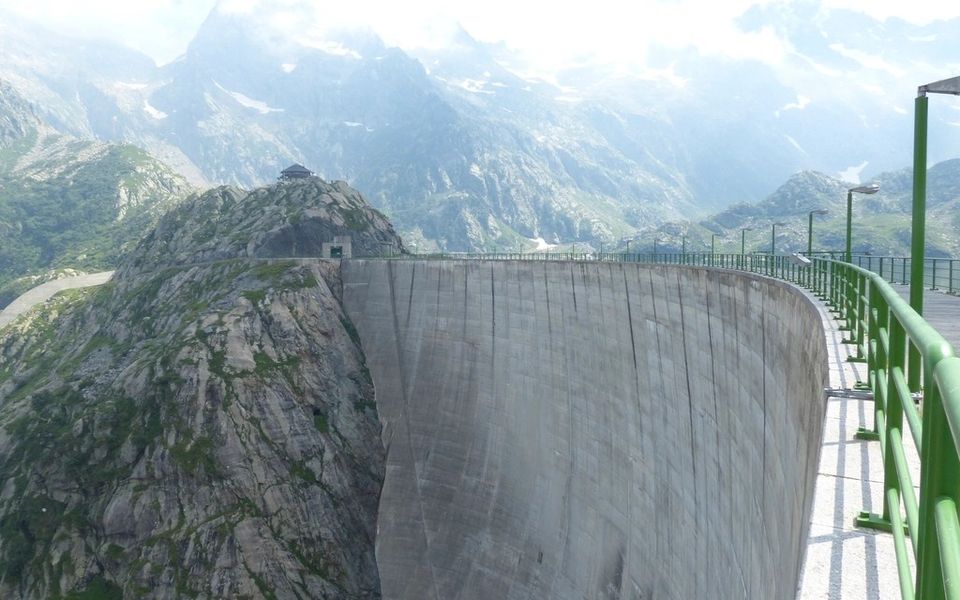 An alpine hydropower dam among mountains