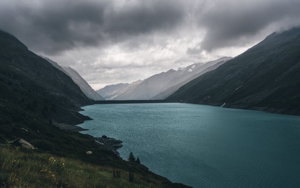 Storm clouds over a mountain reservoir